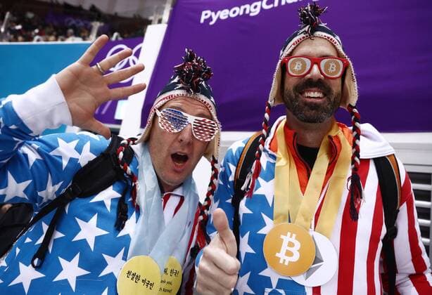 GANGNEUNG, SOUTH KOREA â€“ FEBRUARY 22, 2018: Fans pose at a menâ€™s 500m short track Speed skating Eisschnelllauf quarterfinal race during the 2018 Winter Olympic Games Olympische Spiele Olympia OS at the Gangneung Ice Arena. Valery Sharifulin TASS  TS07533C
