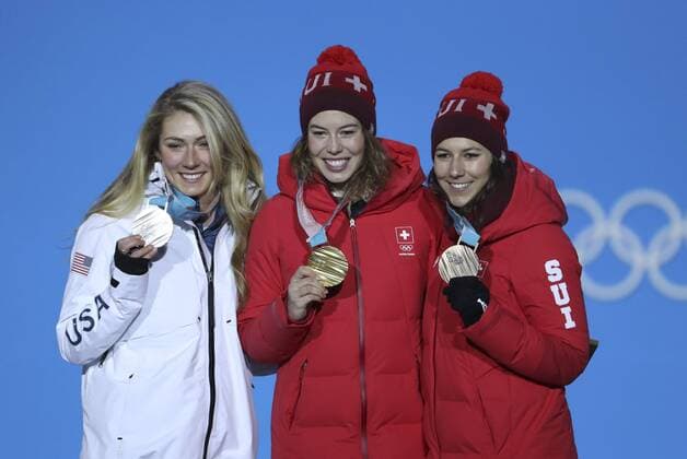 (180222) -- PYEONGCHANG, Feb. 22, 2018 -- Gold medalist Michelle Gisin of Switzerland (C), silver medalist Mikaela Shiffrin of the United States (L) and bronze medalist Wendy Holdener of Switzerland pose for photos during medal ceremony of ladies alpine combined slalom of alpine skiing at the 2018 PyeongChang Winter Olympic Games Olympische Spiele Olympia OS at Medal Plaza, PyeongChang, South Korea, Feb. 22, 2018. ) (SP)OLY-SOUTH KOREA-PYEONGCHANG-ALPINE SKIING-LADIES ALPINE COMBINED SLALOM-MEDAL CEREMONY BaixXuefei 
