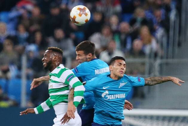 ST PETERSBURG, RUSSIA â€“ FEBRUARY 22, 2018: Celtic s Moussa Dembele and Zenit St Petersburg s Emanuel Mammana, Matias Kranevitter (L-R) jump to head the ball in their Leg 2 of the 2017 18 UEFA Europa League Round of 32 football match at Saint Petersburg Stadium. Peter Kovalev TASS  TS075549