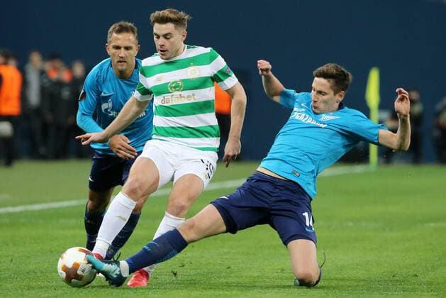 ST PETERSBURG, RUSSIA â€“ FEBRUARY 22, 2018: Zenit St Petersburg s Domenico Criscito (L), Daler Kuzyayev (R) and Celtic s James Forrest (C) fight for the ball in their Leg 2 of the 2017 18 UEFA Europa League Round of 32 football match at Saint Petersburg Stadium. Alexander Demianchuk TASS  TS075542