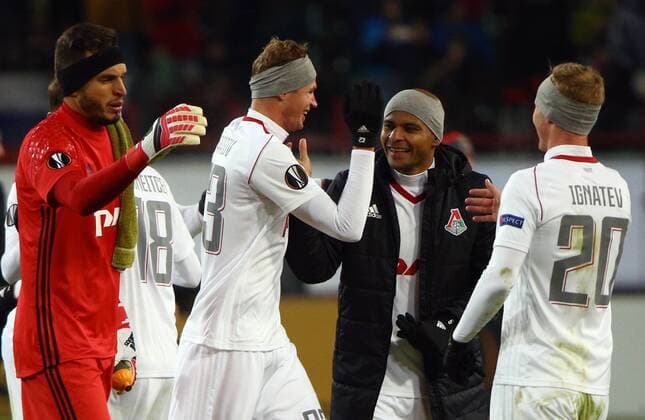 MOSCOW, RUSSIA - FEBRUARY 22, 2018: Lokomotiv Moscow s goalkeeper Guilherme Marinato, Dmitry Tarasov, Ari, and Vladislav Ignatyev (L-R) celebrate winning the 2017 18 UEFA Europa League Round of 32 second leg football match against OGC Nice at RZD Arena Stadium. Lokomotiv Moscow won the game 1-0. Mikhail Tereshchenko TASS  TS07555E