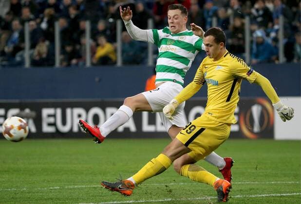 ST PETERSBURG, RUSSIA â€“ FEBRUARY 22, 2018: Celtic s Callum McGregor (L) and Zenit St Petersburg s goalkeeper Andrei Lunev in action in Leg 2 of their 2017 18 UEFA Europa League Round of 32 football match at Saint Petersburg Stadium. Alexander Demianchuk TASS  TS075564