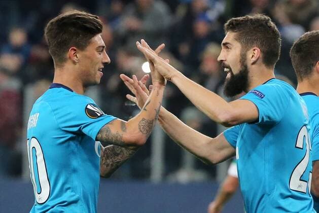 ST PETERSBURG, RUSSIA â€“ FEBRUARY 22, 2018: Zenit St Petersburg s Emiliano Rigoni (L) and Miha Mevlja celebrate scoring in Leg 2 of their 2017 18 UEFA Europa League Round of 32 football match against Celtic F.C. at Saint Petersburg Stadium. Alexander Demianchuk TASS  TS07556F