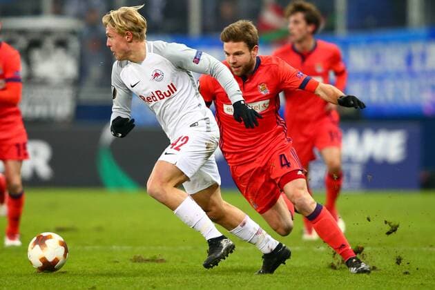 SOCCER - EL, RBS vs Sociedad SALZBURG, AUSTRIA, 22.FEB.18 - SOCCER - UEFA Europa League, Red Bull Salzburg vs Real Sociedad. Image shows Xaver Schlager (RBS) and Asier Illarramendi (Sociedad). GEPAxpictures xFelixxRoittner