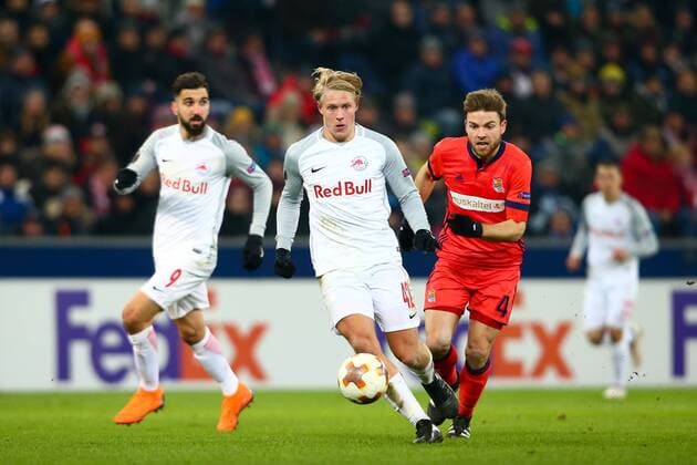 SOCCER - EL, RBS vs Sociedad SALZBURG, AUSTRIA, 22.FEB.18 - SOCCER - UEFA Europa League, Red Bull Salzburg vs Real Sociedad. Image shows Xaver Schlager (RBS) and Asier Illarramendi (Sociedad). GEPAxpictures xFelixxRoittner