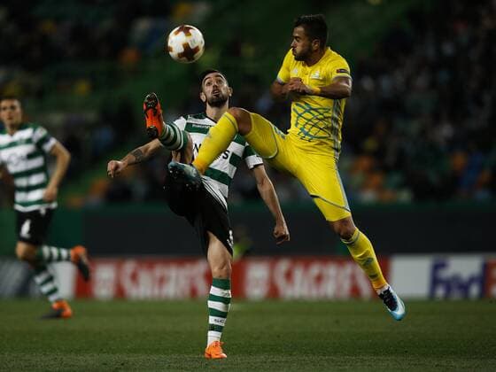 February 22, 2018 - Lisbon, Portugal - Sporting s midfielder Bruno Fernandes (L) vies Astana s midfielder Marko Stanojevic (R) during UEFA Europa League round of 32 second leg football match between Sporting CP vs FC Astana, in Lisbon, on February 21, 2018. Sporting Lisbon v FC Astana - UEFA Europa League  - ZUMAn230 20180222_zaa_n230_511 Copyright: xCarlosxPalmax