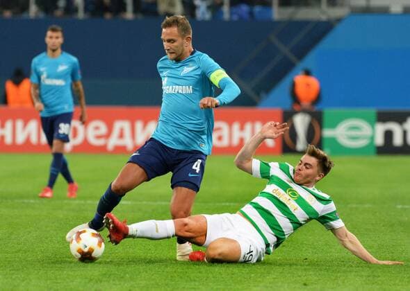 Russia. St. Petersburg. February 22, 2018. Players of Zenit of Domenico Criscito and Celtic James Forrest (from left to right) in a match 1 16 finals of the UEFA Europa League, between the Zenit team (St. Petersburg, Russia) and the Celtic team (Glasgow, Scotland).