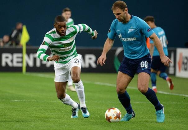Russia. St. Petersburg. February 22, 2018. Players of Celtic Olivier Ntcham and Zenit Branislav Ivanovich (from left to right) in a match 1 16 finals of the UEFA Europa League, between the Zenit team (St. Petersburg, Russia) and the Celtic team (Glasgow, Scotland).
