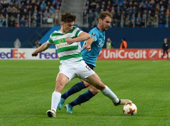 Russia. St. Petersburg. February 22, 2018. Players of Celtic Kieran Tierney and Zenit Branislav Ivanovich (from left to right) in a match 1 16 finals of the UEFA Europa League, between the Zenit team (St. Petersburg, Russia) and the Celtic team (Glasgow, Scotland).