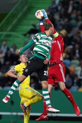 February 22, 2018 - Lisbon, Portugal - Sporting s forward Bas Dost from Holland (L) vies with Astanas goalkeeper Nenad Eric during the UEFA Europa League round of 32 second leg football match between Sporting CP and FC Astana at Alvalade stadium in Lisbon, Portugal on February 22, 2018. Sporting Lisbon v FC Astana - UEFA Europa League  - ZUMAn230 20180222_zaa_n230_588 Copyright: xPedroxFiuzax
