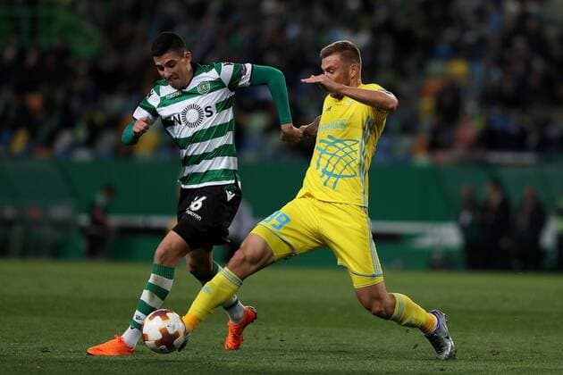 February 22, 2018 - Lisbon, Portugal - Sporting s midfielder Rodrigo Battaglia from Argentina (L) fights for the ball with Astanas midfielder Aleksei Schetkin during the UEFA Europa League round of 32 second leg football match between Sporting CP and FC Astana at Alvalade stadium in Lisbon, Portugal on February 22, 2018. Sporting Lisbon v FC Astana - UEFA Europa League  - ZUMAn230 20180222_zaa_n230_610 Copyright: xPedroxFiuzax