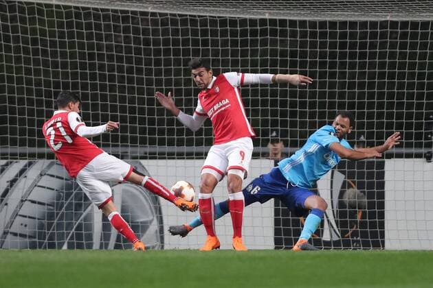 February 22, 2018 - Lisbon, Braga, Portugal - Braga s Portuguese forward Ricardo Horta ( L ) shoots for goal with Braga s Egiptian forward Ahmed Hassan (C ) and Marseille s Portuguese defender Rolando during the UEFA Europa League, match between SC Braga and Olympique Marseille, at Municipal de Braga Stadium in Braga on February 22, 2018, Portugal. Sporting Braga v Marseille - UEFA Europa League  - ZUMAn230 20180222_zaa_n230_625 Copyright: xDpix