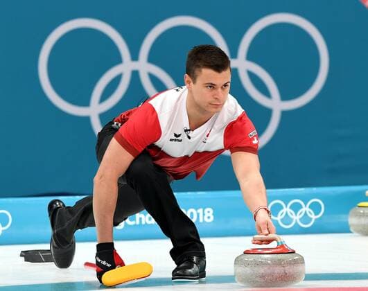 (180223) -- PYEONGCHANG, Feb. 23, 2018 -- Switzerland s Valentin Tanneer competes during bronze medal game of men s curling against Canada at 2018 PyeongChang Winter Olympic Games Olympische Spiele Olympia OS at Gangneung Curling Centre, Gangneung, South Korea, Feb. 23, 2018. Switzerland won 7:5 and claimed bronze medal. ) (SP)OLY-SOUTH KOREA-PYEONGCHANG-CURLING-MEN-BRONZE MEDAL GAME-SUI VS CAN MaxPing 