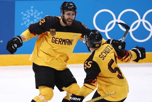 GANGNEUNG, SOUTH KOREA â€“ FEBRUARY 23, 2018: Germany s Matthias Plachta (L) and Feliz Schutz celebrate scoring in their men s semifinal Ice hockey Eishockey match against Canada during the 2018 Winter Olympic Games Olympische Spiele Olympia OS at the Gangneung Hockey Centre. Valery Sharifulin TASS  TS075789