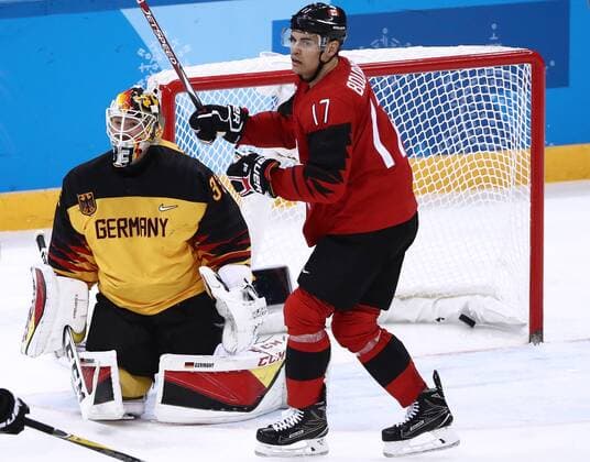 GANGNEUNG, SOUTH KOREA â€“ FEBRUARY 23, 2018: Canada s Rene Bourque (R) reacts as Germany s goaltender Danny aus den Birken concedes a goal in their men s semifinal Ice hockey Eishockey match during the 2018 Winter Olympic Games Olympische Spiele Olympia OS at the Gangneung Hockey Centre. Valery Sharifulin TASS  TS075797