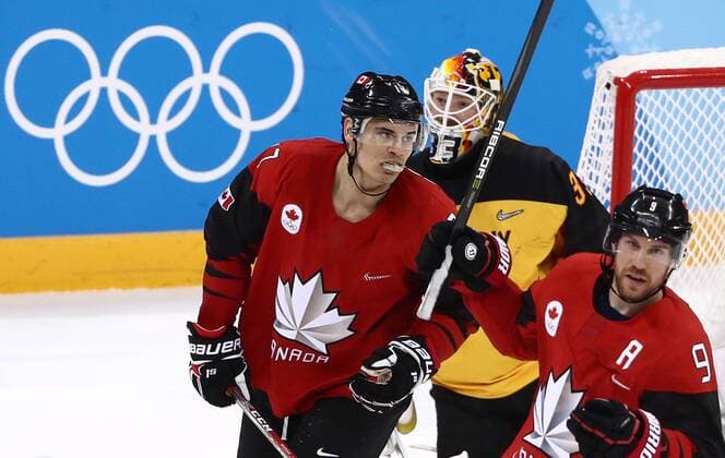 GANGNEUNG, SOUTH KOREA â€“ FEBRUARY 23, 2018: Canada s Rene Bourque and Derek Roy (L-R front) react as Germany s goaltender Danny aus den Birken (back) concedes a goal in their men s semifinal Ice hockey Eishockey match during the 2018 Winter Olympic Games Olympische Spiele Olympia OS at the Gangneung Hockey Centre. Valery Sharifulin TASS  TS075798