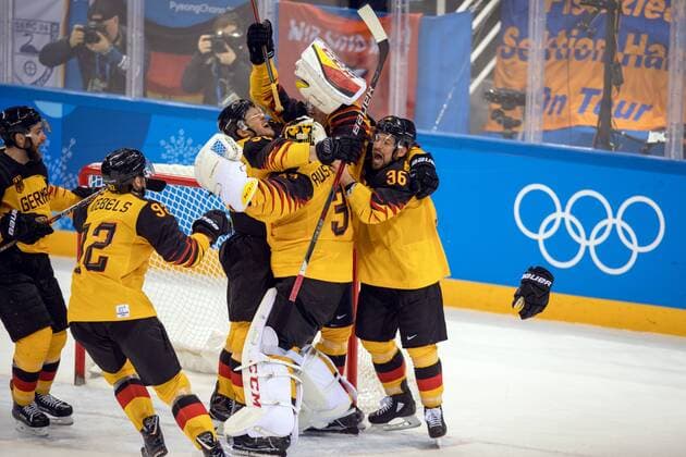 180223 The German team celebrates after the Mens ice hockey semifinal between Canada and Germany during day fourteen of the 2018 Winter Olympics on February 23, 2018 in Pyeongchang Photo Petter Arvidson BILDBYRAN Code PA 91999  Copyright: PETTERxARVIDSON BB180223PA122
