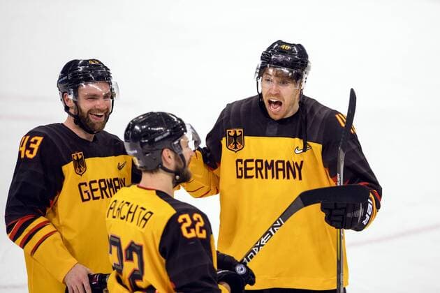 180223 Gerrit Fauser Matthias Plachta and Björn Krupp of Germany celebrate after the Mens ice hockey semifinal between Canada and Germany during day fourteen of the 2018 Winter Olympics on February 23, 2018 in Pyeongchang Photo Petter Arvidson BILDBYRAN Code PA 91999  Copyright: PETTERxARVIDSON BB180223PA142