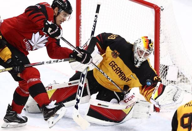 GANGNEUNG, SOUTH KOREA â€“ FEBRUARY 23, 2018: Canada s Rene Bourque (L) attacks Germany s goaltender Danny aus den Birken in their men s semifinal Ice hockey Eishockey match during the 2018 Winter Olympic Games Olympische Spiele Olympia OS at the Gangneung Hockey Centre. Team Germany won the game 4-3 and propelled to the final. Valery Sharifulin TASS  TS0757C2