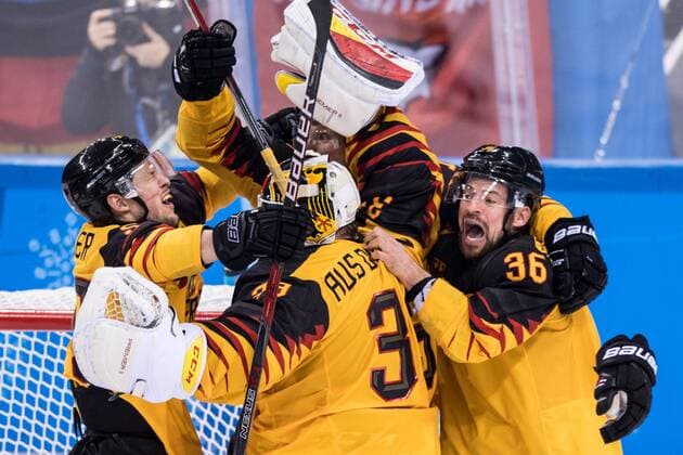 180223 Patrick Hager and Yannic Seidenberg celebrates with goaltender Danny Aus The Birken of Germany after the Mens Ice Hockey Semifinal between Canada and Germany during day fourteen of the 2018 Winter Olympics on February 23, 2018 in Pyeongchang Photo Petter Arvidson BILDBYRAN Code PA 92000  Copyright: PETTERxARVIDSON BB180223PA155