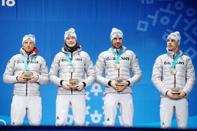 180224 Erik Lesser Benedict Doll Arnd Peiffer and Simon Schempp of Germany Bronze celebrates at the Medal Ceremony for the Mens Biathlon 4x7 5 km relay during day fifteen of the 2018 Winter Olympics on February 24, 2018 in Pyeongchang Photo Carl Sandin BILDBYRAN Code CS 57999 322  Copyright: CARLxSANDIN BB180224CS121