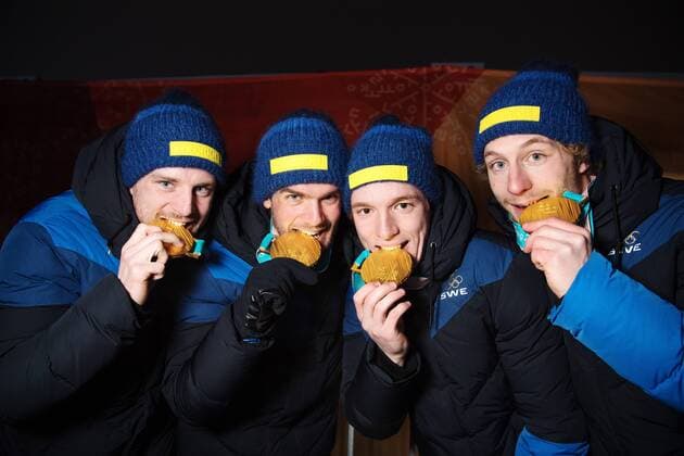 180224 Peppe Femling Jesper Nelin Sebastian Samuelsson and Fredrik Lindström of Sweden Gold bites theri medals while posing for a picture and celebrating at the Medal Ceremony for the Mens Biathlon 4x7 5 km relay during day fifteen of the 2018 Winter Olympics on February 24, 2018 in Pyeongchang Photo Carl Sandin BILDBYRAN Code CS 57999 322  Copyright: CARLxSANDIN BB180224CS124