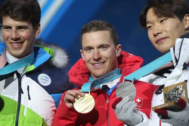 OLYMPICS - 2018 Winter Olympics PYEONGCHANG,SOUTH KOREA,24.FEB.18 - OLYMPICS, SNOWBOARDING - Olympic Winter games Winterspiele Spiele Summer games PyeongChang 2018, Medals Plaza, award ceremony, parallel giant slalom, men. Image shows Zan Kosir (SLO), Nevin Galmarini (SUI) and Sangho Lee (KOR). Keywords: medal. GEPAxpictures xMathiasxMandl