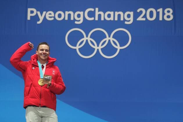 OLYMPICS - 2018 Winter Olympics PYEONGCHANG,SOUTH KOREA,24.FEB.18 - OLYMPICS, SNOWBOARDING - Olympic Winter games Winterspiele Spiele Summer games PyeongChang 2018, Medals Plaza, award ceremony, parallel giant slalom, men. Image shows Nevin Galmarini (SUI). Keywords: medal. GEPAxpictures xMathiasxMandl