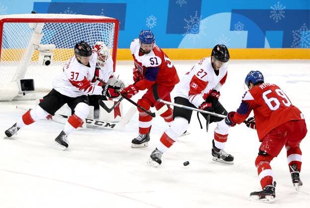 GANGNEUNG, SOUTH KOREA - FEBRUARY 24, 2018: The Czech Republic s Roman Horak (2nd L), Lukas Radil (R), and Canada s Mat Robinson (L) and Cody Goloubef in the men s bronze medal Ice hockey Eishockey game at Gangneug Hockey Centre at the 2018 Winter Olympic Games Olympische Spiele Olympia OS Valery Sharifulin TASS  TS07595C