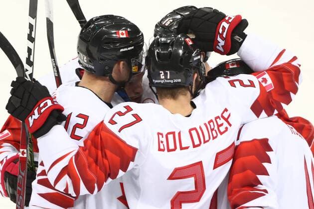 GANGNEUNG, SOUTH KOREA - FEBRUARY 24, 2018: Canada s Rob Klinkhammer (L), Cody Goloubef (C), and their teammate celebrate a goal against the Czech Republic in the men s bronze medal Ice hockey Eishockey game at Gangneung Hockey Centre at the 2018 Winter Olympic Games Olympische Spiele Olympia OS Valery Sharifulin TASS  TS075963