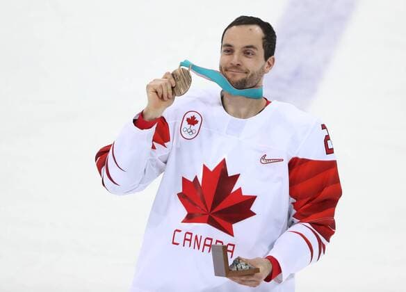 GANGNEUNG, SOUTH KOREA - FEBRUARY 24, 2018: Canada s Stefan Elliott shows his bronze medal after winning the men s bronze medal Ice hockey Eishockey game between the Czech Republic and Canada at Gangneug Hockey Centre at the 2018 Winter Olympic Games Olympische Spiele Olympia OS Canada won the game 6-4. Valery Sharifulin TASS  TS075997