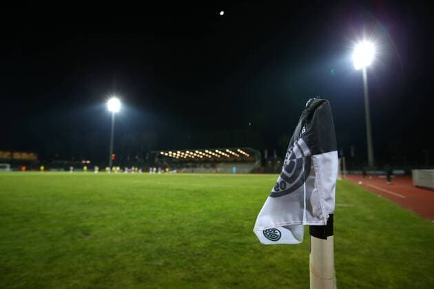 Thursday 22 02 2018 Season 2017 2018 20 Round of the Regionalliga West in Bochum Lohrheidestadion SG Wattenscheid 09 BVB 09 Borussia Dortmund II Opposite stand at floodlights with corner flag with logo of SGW