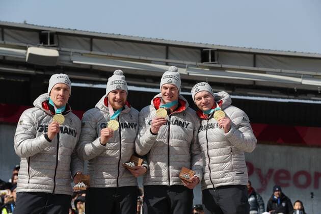 (180225) -- PYEONGCHANG, Feb. 25, 2018 -- Team Germany that won the gold medal pose for photos after the 4-man event of bobsleigh at the 2018 PyeongChang Winter Olympic Games Olympische Spiele Olympia OS at Olympic Sliding Centre, PyeongChang, South Korea, Feb. 25, 2018. The team won the gold medal in a time of 3:15.85. ) (SP)OLY-SOUTH KOREA-PYEONGCHANG-BOBSLEIGH-4-MAN BaixXuefei 