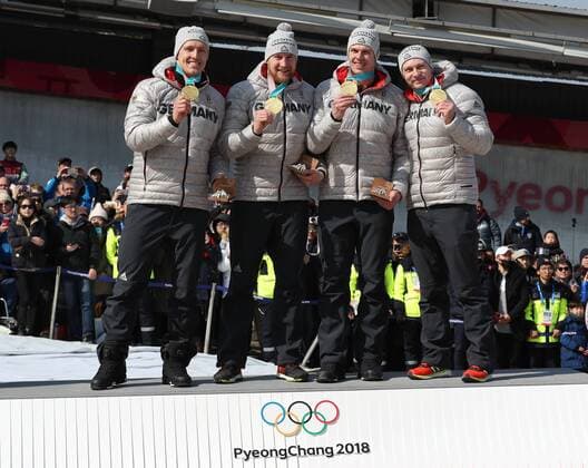 (180225) -- PYEONGCHANG, Feb. 25, 2018 -- Team Germany that won the gold medal pose for photos after the 4-man event of bobsleigh at the 2018 PyeongChang Winter Olympic Games Olympische Spiele Olympia OS at Olympic Sliding Centre, PyeongChang, South Korea, Feb. 25, 2018. The team won the gold medal in a time of 3:15.85. ) (SP)OLY-SOUTH KOREA-PYEONGCHANG-BOBSLEIGH-4-MAN BaixXuefei 