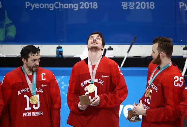 GANGNEUNG, SOUTH KOREA - FEBRUARY 25, 2018: Gold medalists, the Olympic Athletes from Russia, Pavel Datsyuk, Sergei Kalinin, and Mikhail Grigorenko (L-R) at a victory ceremony for the men s Ice hockey Eishockey event at Gangneung Hockey Centre at the 2018 Winter Olympic Games Olympische Spiele Olympia OS The Olympic Athletes from Russia won 4-3 in overtime. Valery Sharifulin TASS  TS075A57