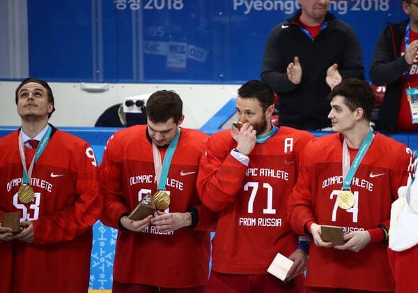 GANGNEUNG, SOUTH KOREA - FEBRUARY 25, 2018: Gold medalists, the Olympic Athletes from Russia, Bogdan Kiselevich, Ilya Kovalchuk, and Nikolai Prokhorkin (L-R) at a victory ceremony for the men s Ice hockey Eishockey event at Gangneung Hockey Centre at the 2018 Winter Olympic Games Olympische Spiele Olympia OS The Olympic Athletes from Russia won 4-3 in overtime. Valery Sharifulin TASS  TS075A5B