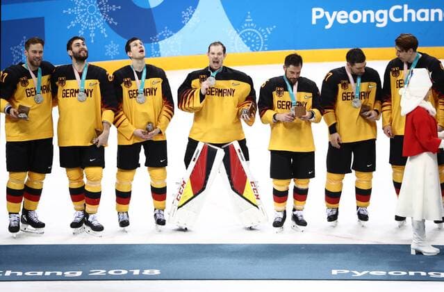 GANGNEUNG, SOUTH KOREA - FEBRUARY 25, 2018: Silver medalists, players of Germany at a victory ceremony for the men s Ice hockey Eishockey event at Gangneung Hockey Centre at the 2018 Winter Olympic Games Olympische Spiele Olympia OS The Olympic Athletes from Russia won 4-3 in overtime. Valery Sharifulin TASS  TS075A6A