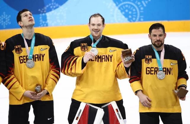 GANGNEUNG, SOUTH KOREA - FEBRUARY 25, 2018: Silver medalists, players of Germany at a victory ceremony for the men s Ice hockey Eishockey event at Gangneung Hockey Centre at the 2018 Winter Olympic Games Olympische Spiele Olympia OS The Olympic Athletes from Russia won 4-3 in overtime. Valery Sharifulin TASS  TS075A6B