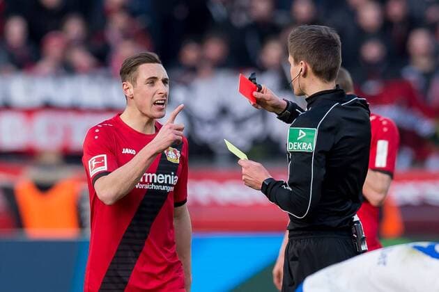 Leverkusen Germany 25 02 2018 1 Bundesliga 24 Matchday Bayer 04 Leverkusen FC Schalke 04 Dominik Kohr B04 receives from referee Daniel Siebert the yellow card DeFodi001