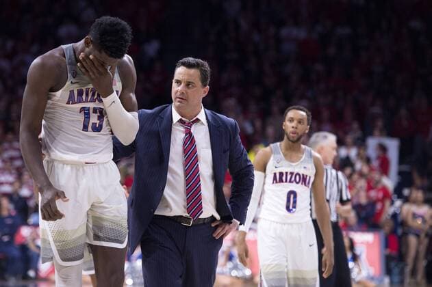 March 1, 2018 - Tucson, Arizona, U.S - Arizona s head coach SEAN MILLER, right, checks on Arizona s DEANDRE AYTON (13) after an injury against Stanford Thursday, March 1, 2018, at McKale Center in Tucson, Arizona. Arizona won 75-67 against Stanford. NCAA College League USA Basketball 2018 Arizona vs Stanford - ZUMAb166 20180301_zap_b166_013 Copyright: xJeffxBrownx