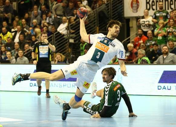 Piotr Chrapkowski Fabian Wiede action match scene duel sports handball DHB Cup DKB Bundesliga Mens Season 2017 2018 07 03 2018 Füchse Berlin vs SC Magdeburg SCM