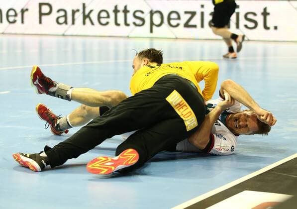 Goalkeeper Silvio Heinevetter Marko Bezjak clashes Action Game scene Duel sports Handball DHB Cup DKB Bundesliga Mens Season 2017 2018 07 03 2018 Füchse Berlin vs SC Magdeburg SCM