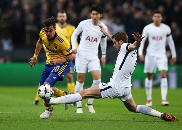 7th March 2018, Wembley Stadium, London England; UEFA Champions League football, round of 16, 2nd leg, Tottenham Hotspur versus Juventus; Jan Vertonghen of Tottenham Hotspur fouls Paulo Dybala of Juventus  ActionPlus11998953