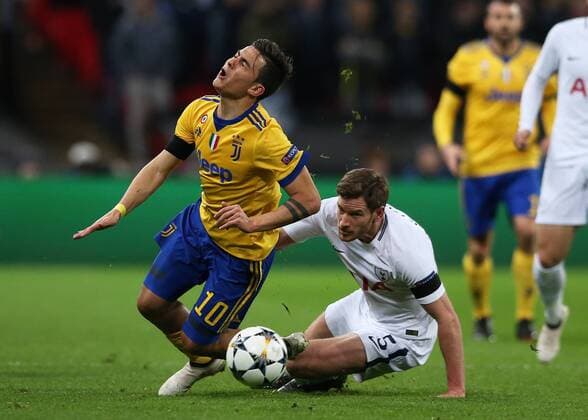 7th March 2018, Wembley Stadium, London England; UEFA Champions League football, round of 16, 2nd leg, Tottenham Hotspur versus Juventus; Jan Vertonghen of Tottenham Hotspur fouls Paulo Dybala of Juventus  ActionPlus11998954