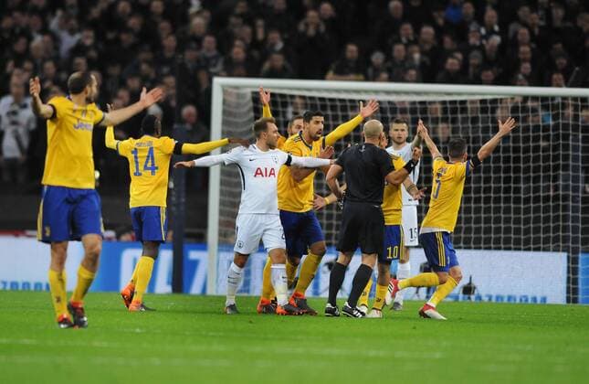 Football - 2017 2018 UEFA Champions League - Round of Sixteen, Second Leg: Tottenham Hotspur (2) vs. Juventus (2) Italian players appeal to referee,Szymon Marciniak, at Wembley Stadium. COLORSPORT ANDREW COWIE 