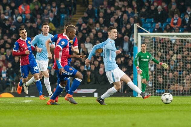 Manchester City v FC Basel UEFA Champions League Phil Foden of Manchester City passes the ball out ahead of Serey Die of Basel during the UEFA Champions League match at the Etihad Stadium, Manchester Content Not Available For UK Newspapers Copyright: xMattxWilkinsonx FIL-11459-0022