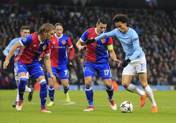 7th March 2018, Etihad Stadium, Manchester, England; UEFA Champions League football, round of 16, 2nd leg, Manchester City versus FC Basel; Leroy Sane of Manchester City is challenged by Marek Suchy of Basel  ActionPlus11998978