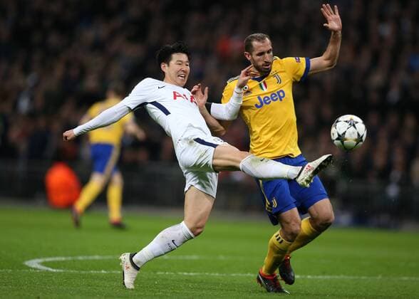 7th March 2018, Wembley Stadium, London England; UEFA Champions League football, round of 16, 2nd leg, Tottenham Hotspur versus Juventus; Giorgio Chiellini of Juventus puts pressure on Son Heung-Min of Tottenham Hotspur  ActionPlus11998990