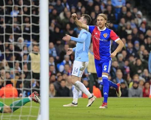 7th March 2018, Etihad Stadium, Manchester, England; UEFA Champions League football, round of 16, 2nd leg, Manchester City versus FC Basel; Michael Lang of Basel watches his shot hit the net to score in the 70th minute to make it 1-2 to Basel  ActionPlus11999010