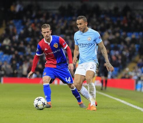 7th March 2018, Etihad Stadium, Manchester, England; UEFA Champions League football, round of 16, 2nd leg, Manchester City versus FC Basel; Danilo of Manchester City passes the ball away from Valentin Stocker of Basel  ActionPlus11999051
